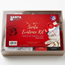 Load image into Gallery viewer, Santa Evidence Kit in a kraft box with a  clear plastic lid with a red front insert card, showing the product packaging and included contents on a white background.
